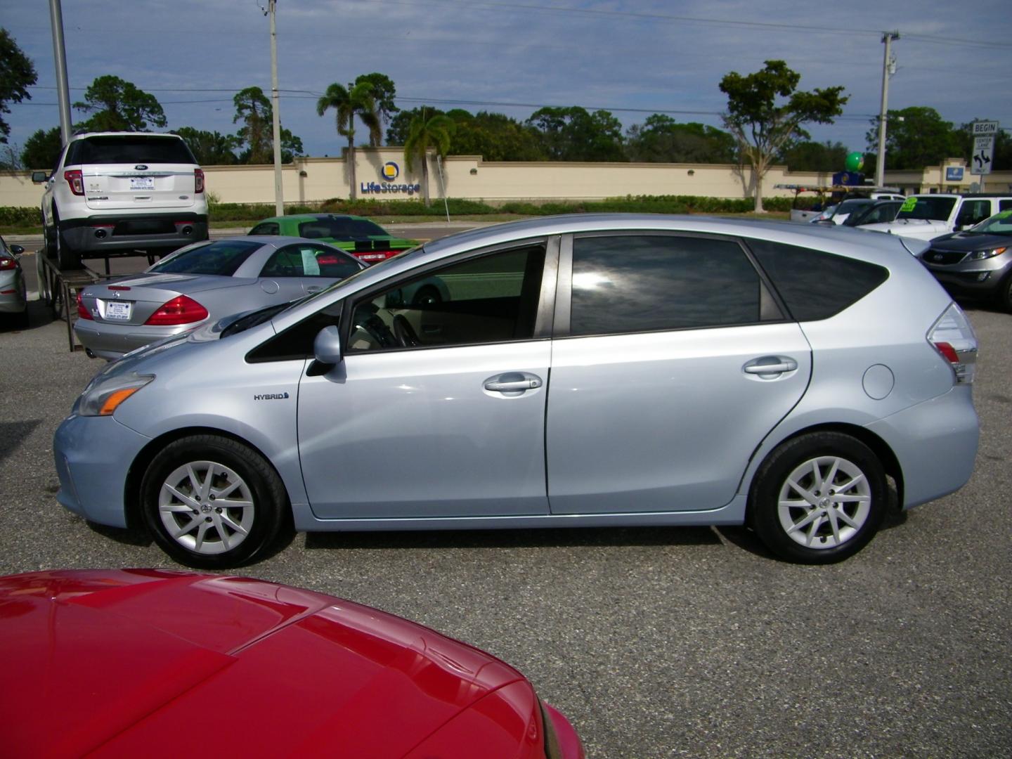 2013 Silver /Beige Toyota Prius V Three (JTDZN3EU5D3) with an 1.8L L4 DOHC 16V HYBRID engine, Continuously Variable Transmission transmission, located at 4000 Bee Ridge Road, Sarasota, FL, 34233, (941) 926-0300, 27.298664, -82.489151 - Photo#5